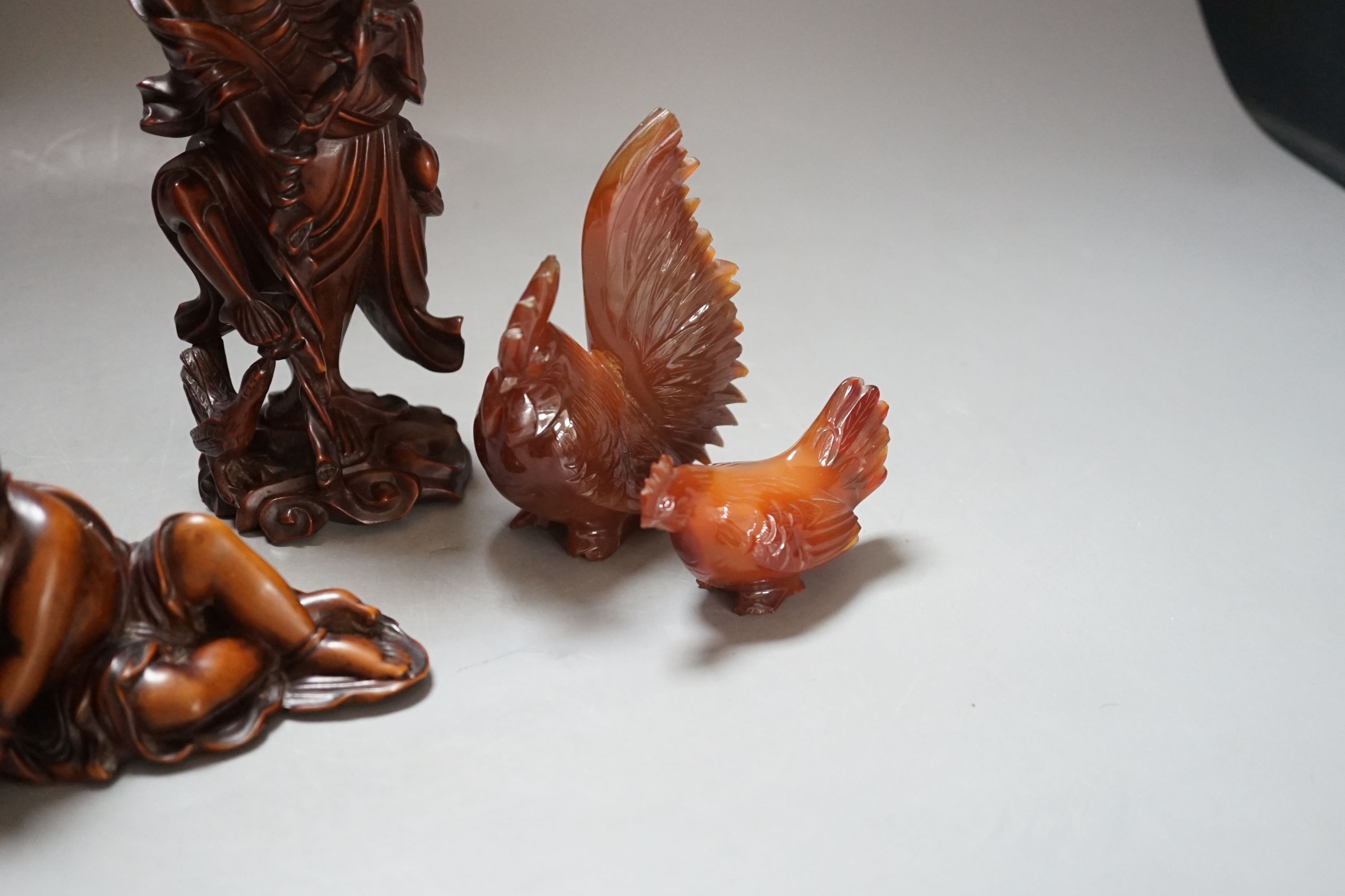 Three Chinese boxwood figures of two luohan, 18cm and Liu Hai and two hardstone chickens